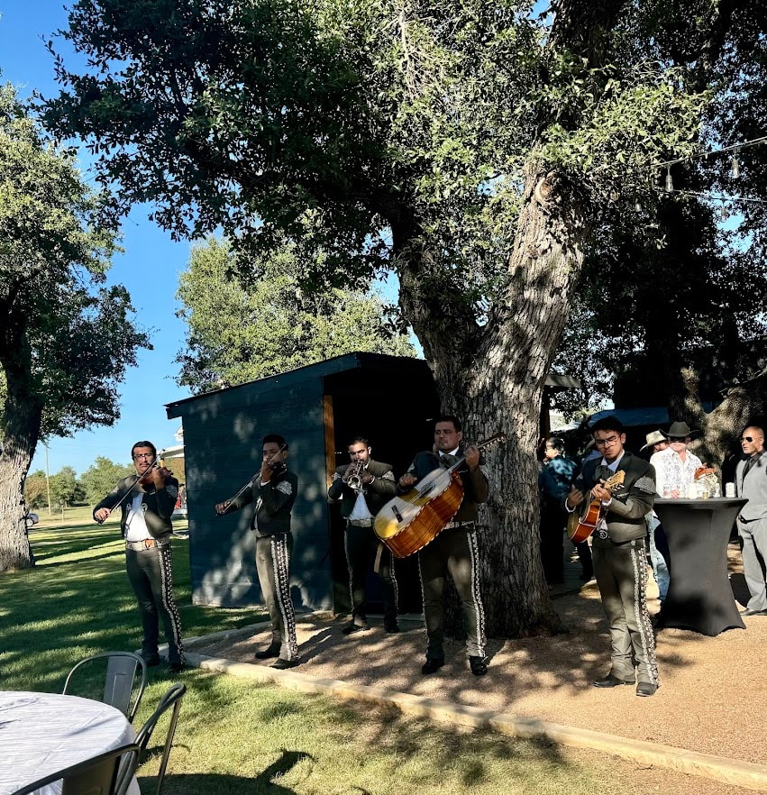 Mariachi band performing outdoors under live oak trees at a Hill Country wedding at Willow Sky Ranch near Fredericksburg, Texas — live music for every moment