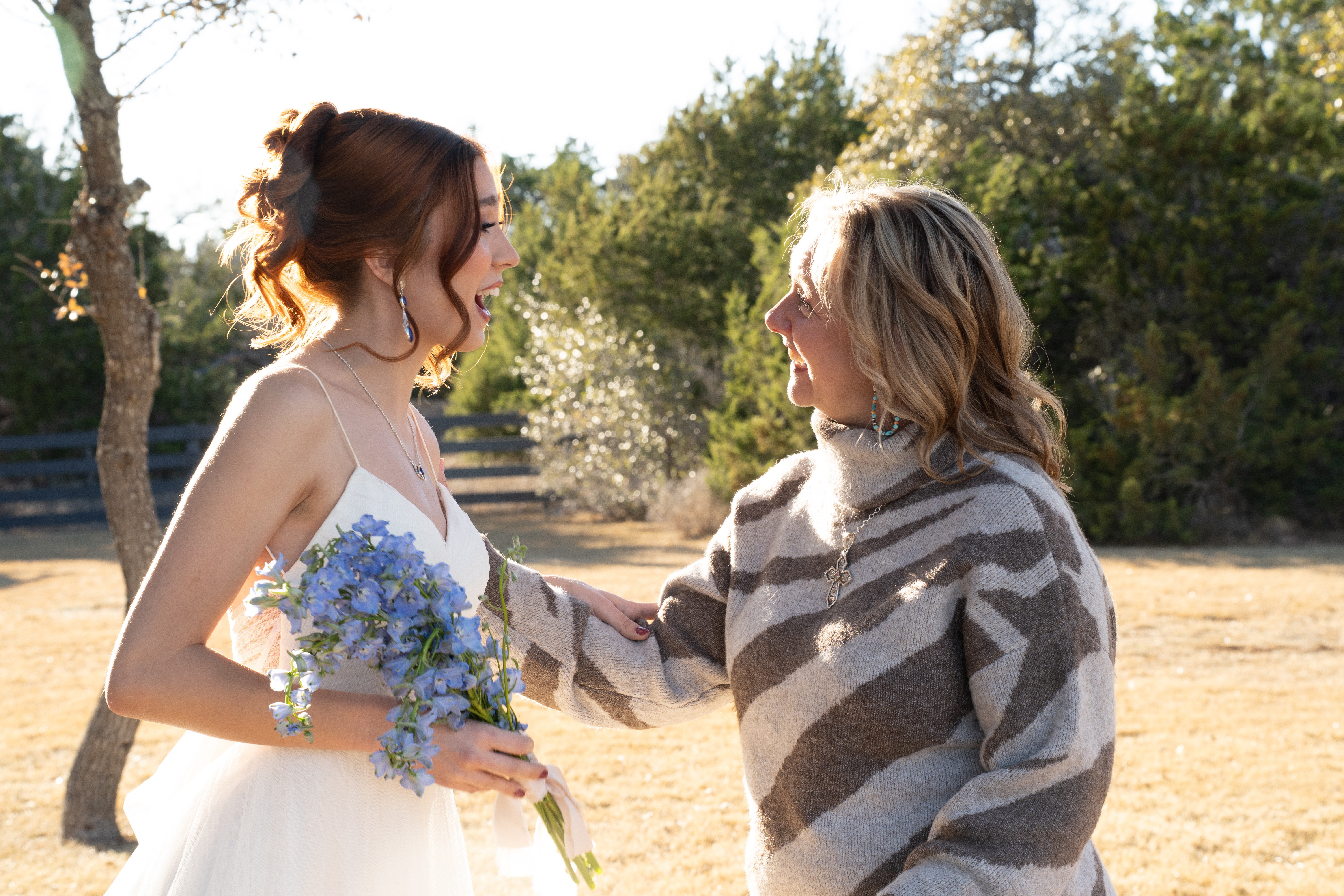 Jennifer Frezon, Willow Sky Ranch owner, congratulating a bride on her big day — family owned means you become one of the family at this private Hill Country wedding venue near Fredericksburg, Texas